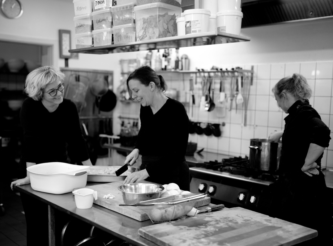 Women cooking in kitchen of restaurant